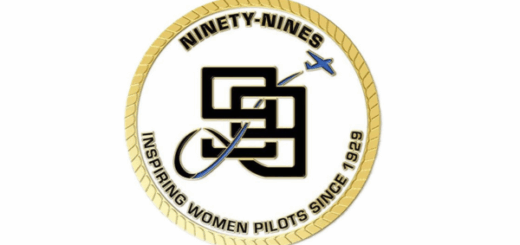 The back side of the 99s Challenge Coin featuring the 99s numerical logo with the airplane departing to the right