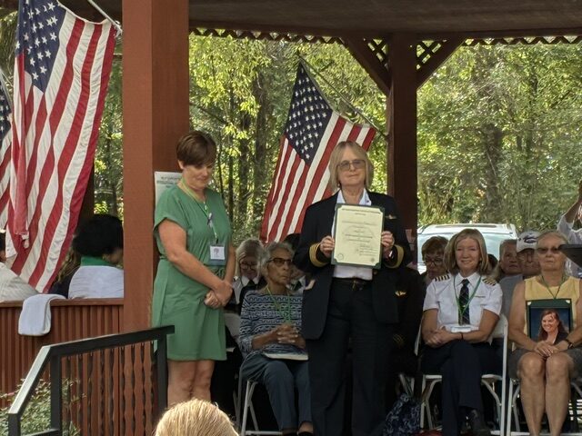 Captain Carolyn Pasqualino receives her Forest of Friendship certificate.