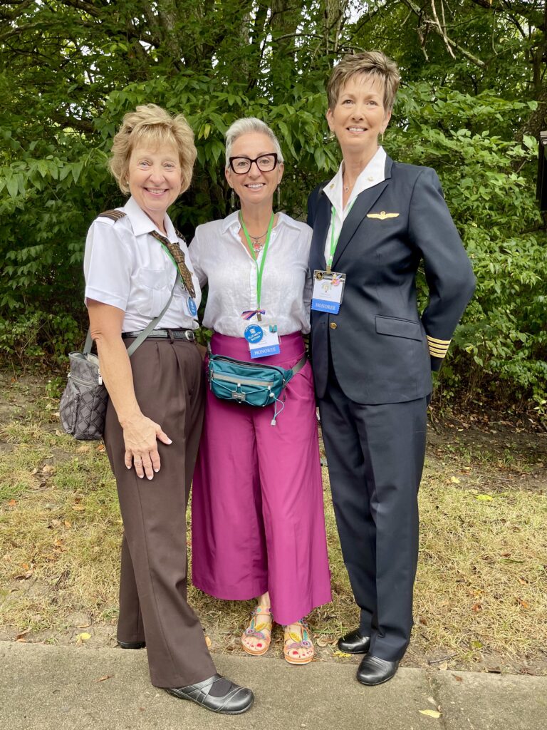 Liz Booker stands inbetween fellow Ninety-Nines member Terri Donner (left) and Valerie Scott (right).
